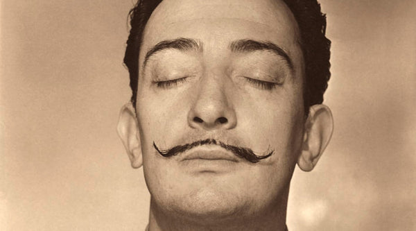 Image of Salvador Dali with closed eyes and smelling b yHorst P (source: Conde Nast/Dali Museum Archives)) 